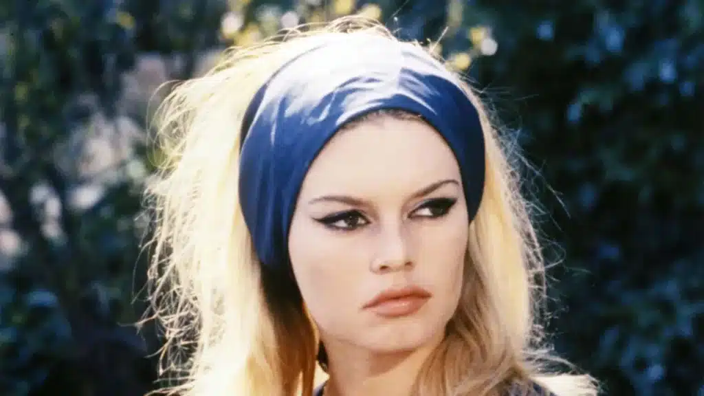 post war times - actor Ursula Andress wearing a blue headband