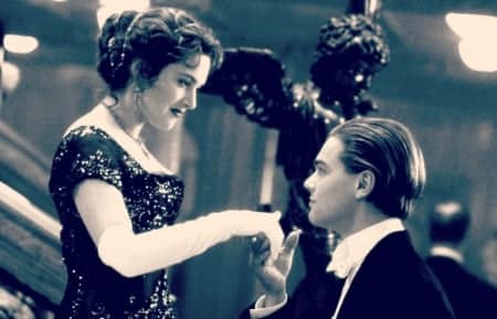 the great war and beyond - rose and jack from the titanic movie where she holds her hand up to him to embrace wearing white dinner gloves