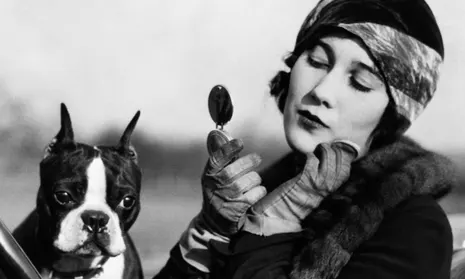 the great war and beyond - lady with a dog powdering her face wearing gauntlet gloves