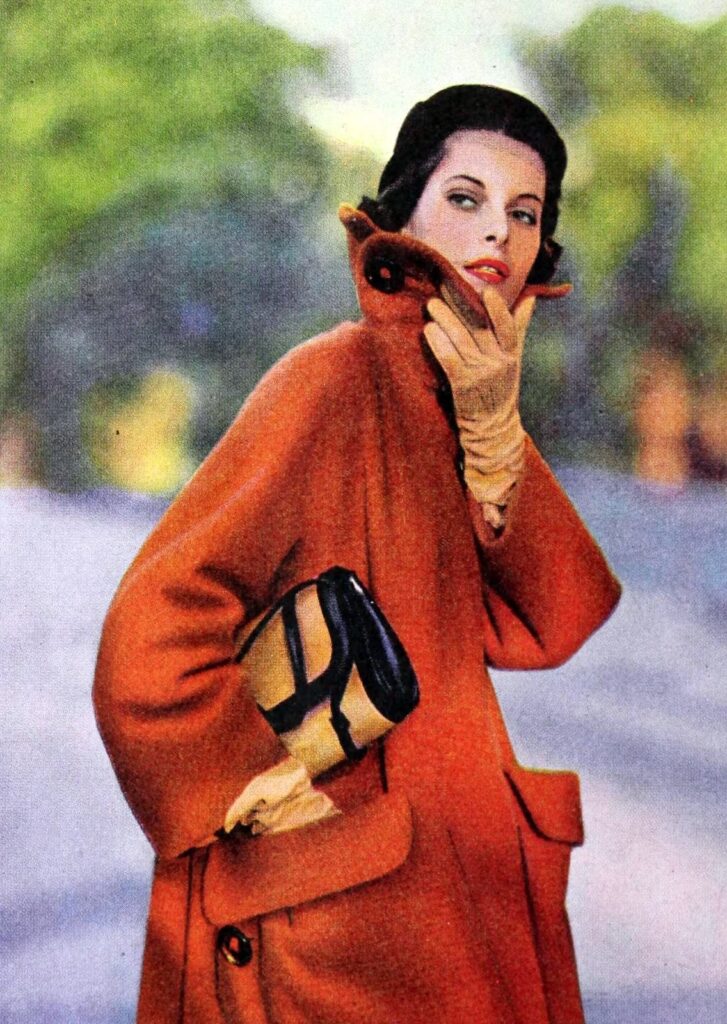 gloves become less popular - 1060's woman in large coat and faun gloves matching handbag