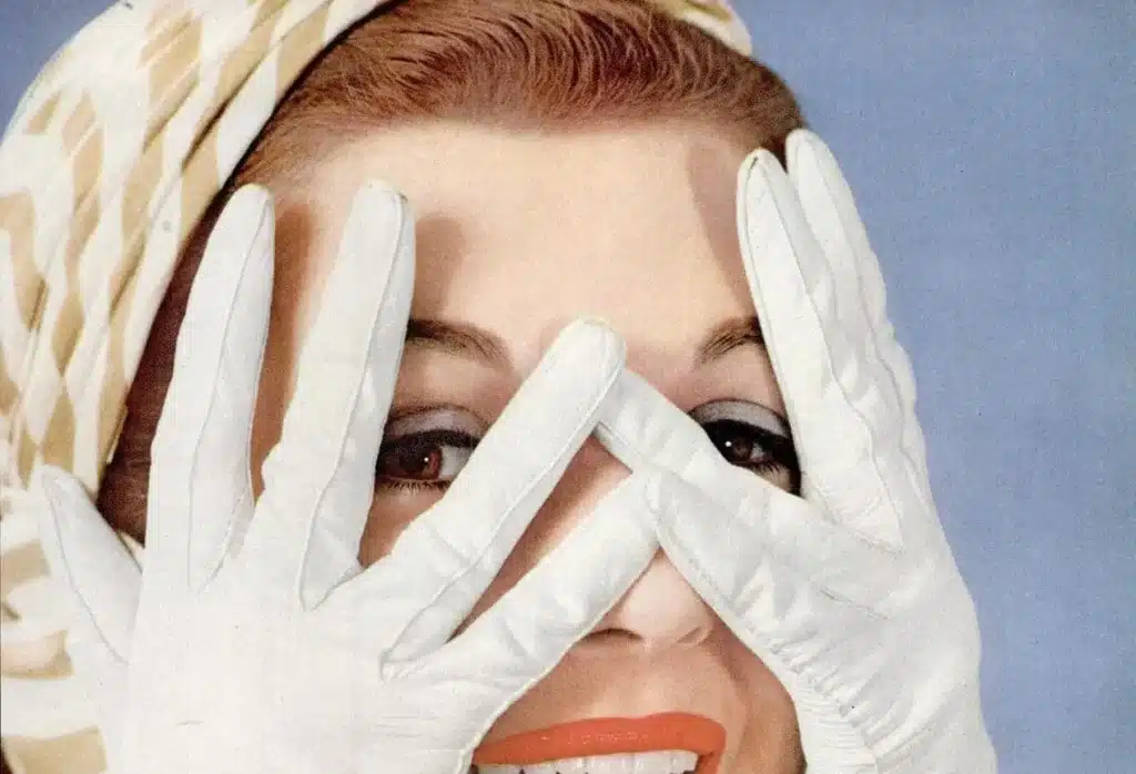 adding a vintage accessory - 1960's woman with headscarf on and holding gloved hands over face