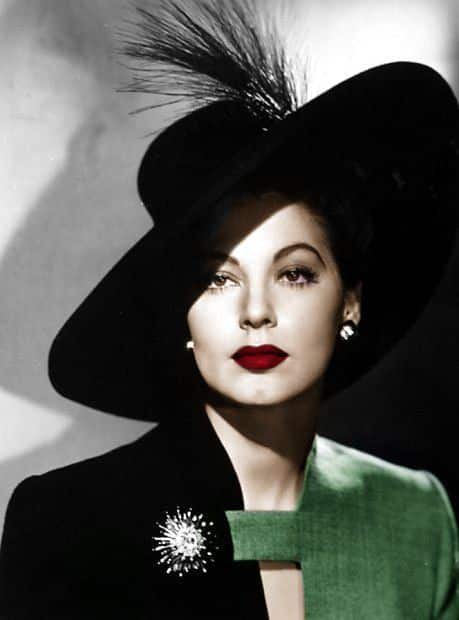 world war 2 - woman in two toned suit and wide brimmed hat adorned with feathers