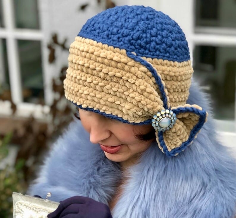 fitted hats - lady from the t.v series downton abbey - wearing a crochet cloche hat with a bow brooch and faux fur stole