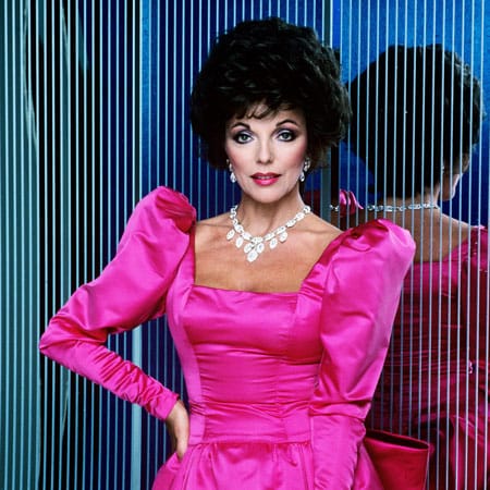 the computer age - joan collins from the show dynasty in a satin evening gown