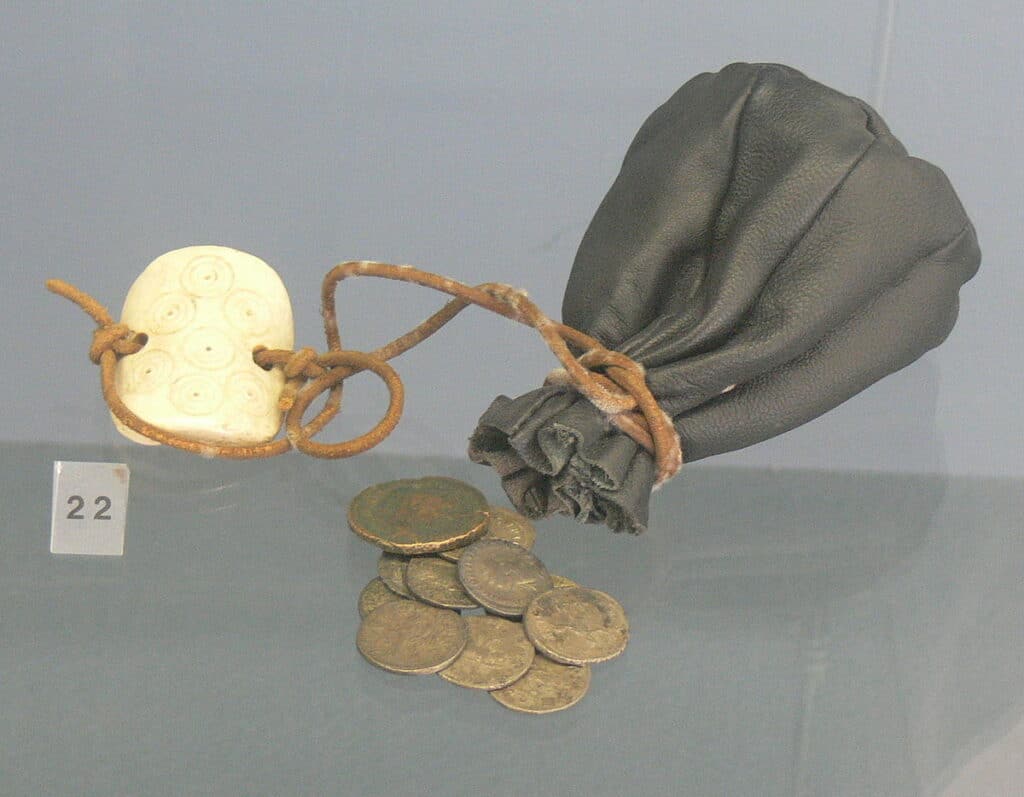 the early beginnings of bags - antique leather coin purse with drawstring and weight