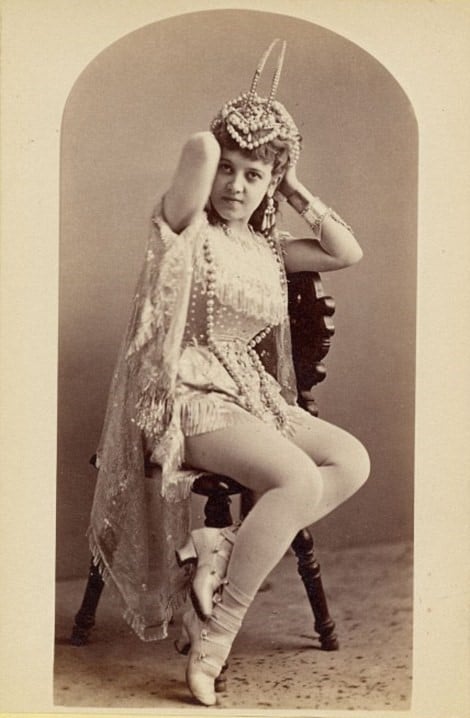 vaudeville emerges - scandalous woman in very short dress and sheer stockings