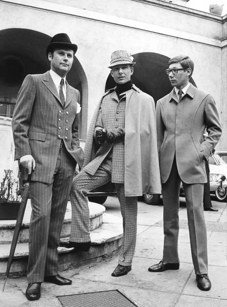mid century style - men dressed in various suit jacket style with accompanied coat and hats to match