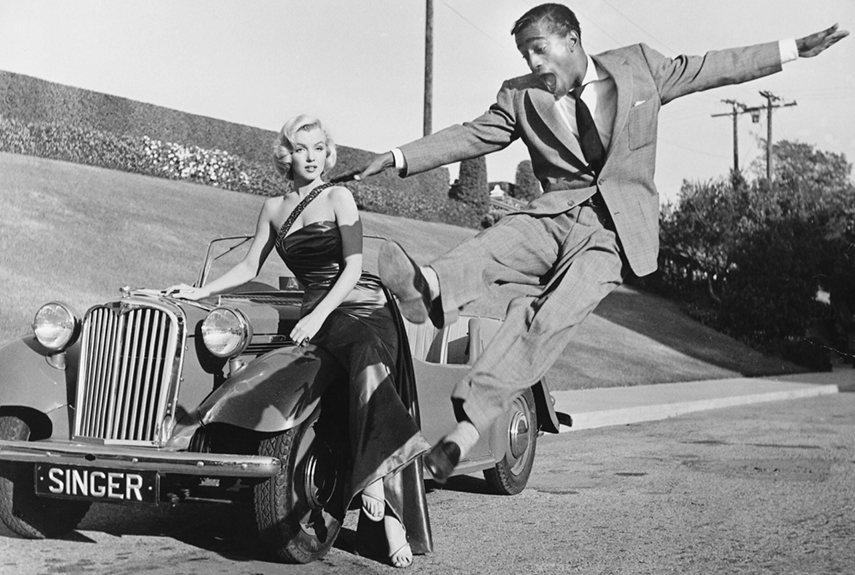 do vintage clothes maketh the gentleman - sammy davis jnr leaping in front on marilyn monroe leaning on a vintage car