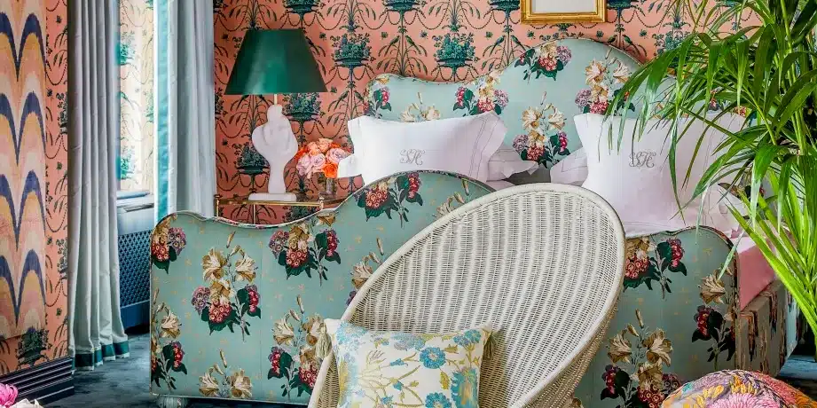 the beauty and appeal of vintage textiles - chintz fabric design used to upholster furniture in a room decorated with wall paper and indoor plants