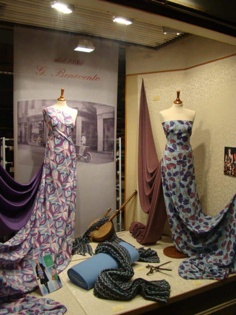 diy fashion - vintage shop window depicting mannequins draped in different fabrics