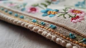 the beauty and appeal of vintage fabrics - heavy vintage embroidered fabric with floral design