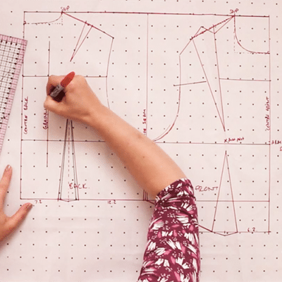 deciphering the code of vintage patterns - woman drawing pattern from scratch using old methods