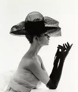 gloves in the 40's and 50's - audrey hepburn in a model pose with strapless evening dress large hat and long black gloves