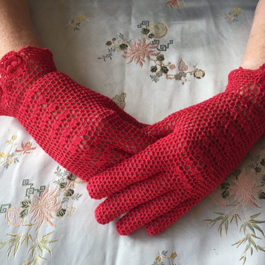 adding a vintage accessory - lady with crossed hands in red crochet gloves