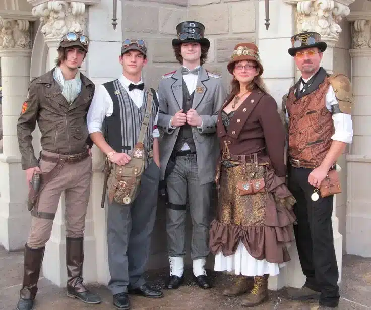 cultural significance of steampunk fashion in modern wardrobes - DIY steampunk enthusiasts wearing aviator, victorian or industrialized  working class outfits