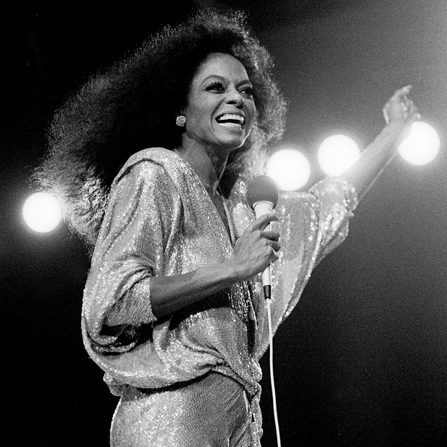 why vintage icons captivated the world - diana ross on stage with microphone wearing a lame 1980's dress