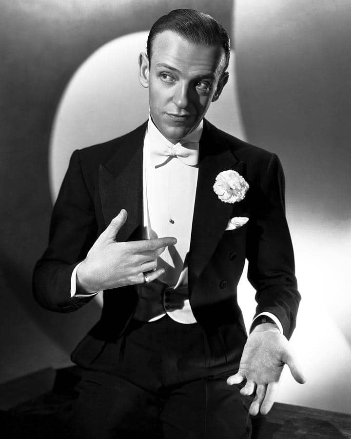 the impact of fashion's golden age icons - fred astaire looking sideways in a white tux tie and black tails