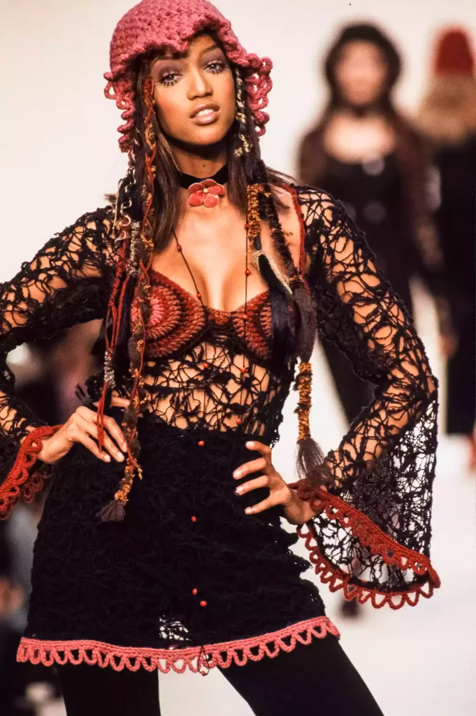 why vintage icons captivated the world - tyra banks in a crochet bohemian mini outfit at a catwalk