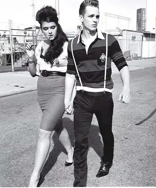 rockabilly in modern times, how the spirit continues to influence fashion - couple from the 1950's sporting tight clothing pompadour hair and and cigarettes