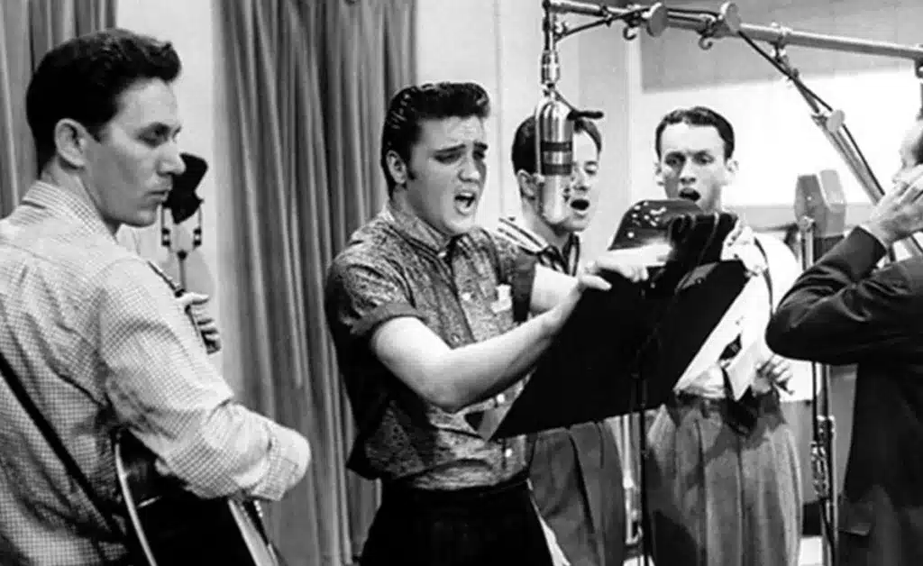 the enduring popularity of rockabilly style fusing music and fashion - elvis presley in recording studio with a band