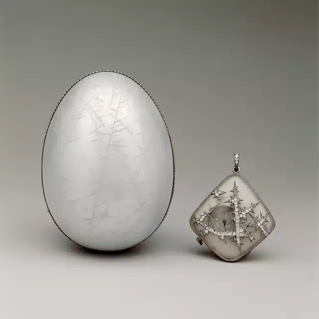 how to faberge egg symbolized the fusion of artistry, innovation and tradition - metallic looking noble ice egg with a pendant on th side of icicles circa 1914