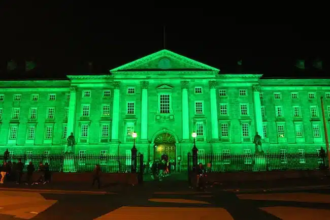 contemporary celebrations - buildings lit up in honour of the patron saint - trinity college dublin