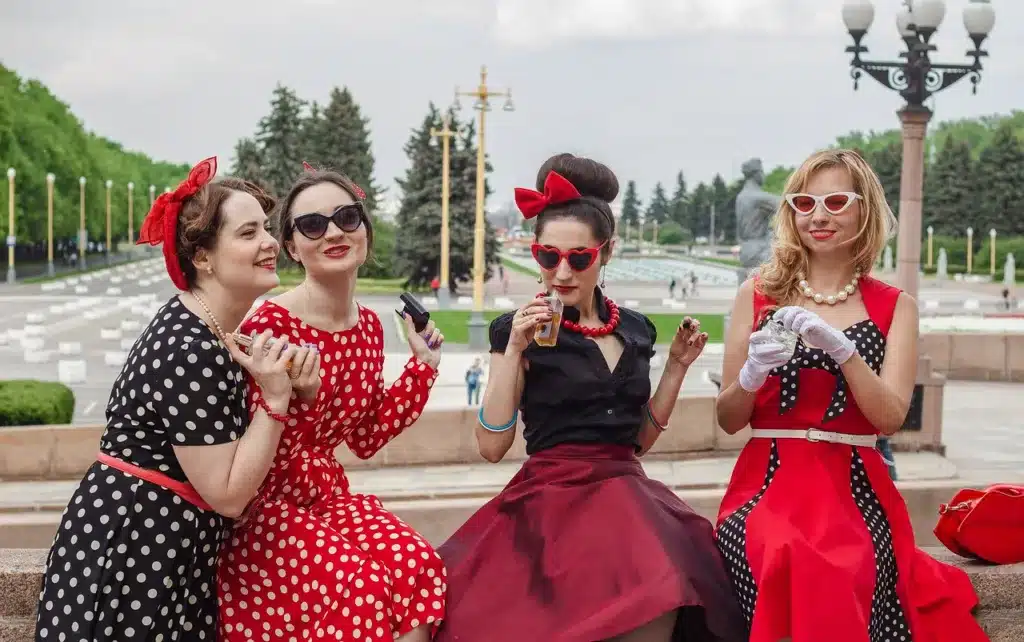 current rockabilly fashion trends, what is hot in today's scene - 4 ladies wearing polka dot dresses and cat-eye sunglasses