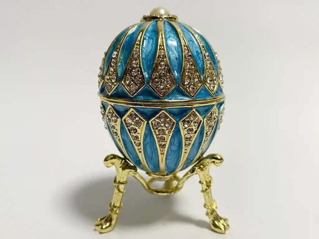 the symbolic grandeur of faberge eggs - house of faberge blue and gold egg with pearl top