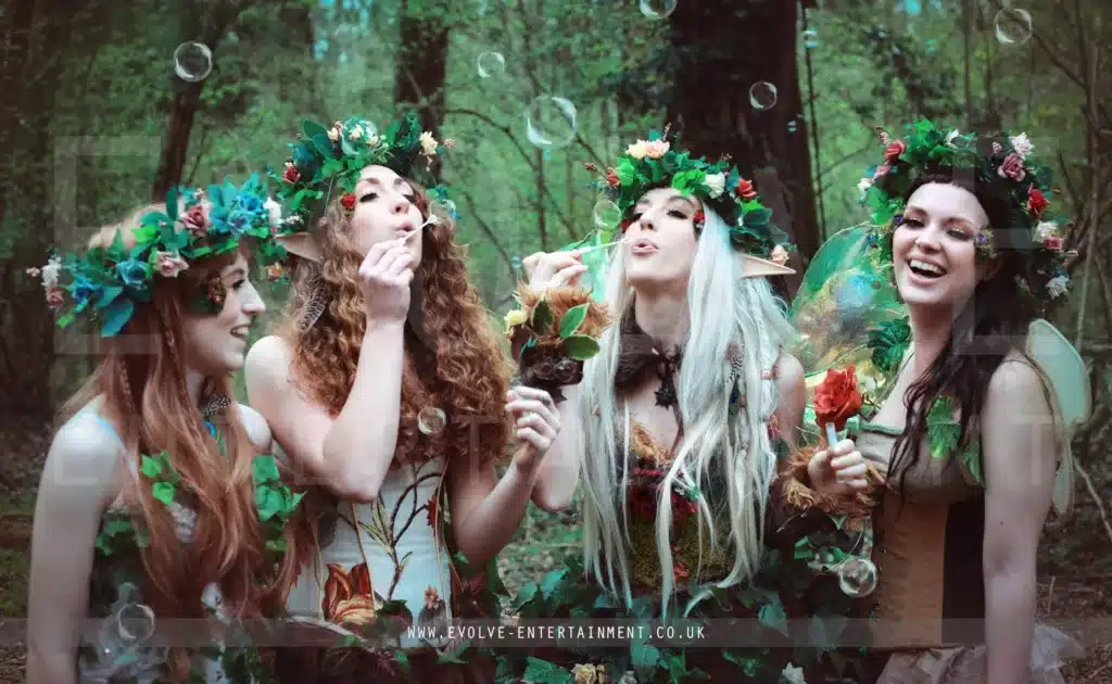 the fascinating world of themed parties, fairy tale fantasy - 4 women in green fairy costumes and head wreaths