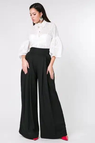 classic wide leg trousers, foundation of workwear flexibility, woman in black pleated pants and white blouse