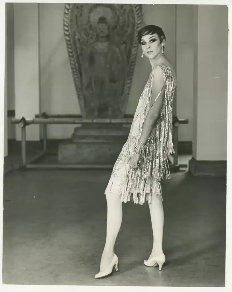 key elements of 1920's flapper girl fashion - loose and fringed fabrics, girl in embellished fringed flapper dress