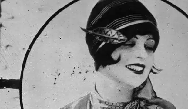 key elements in 1920's flapper girl fashion - cloche hats, lady in fitted cloche hat