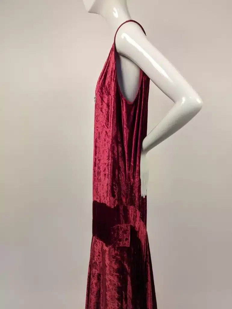 the historic allure of velvet in fashion - 1920's cherry red flapper dress on mannequin