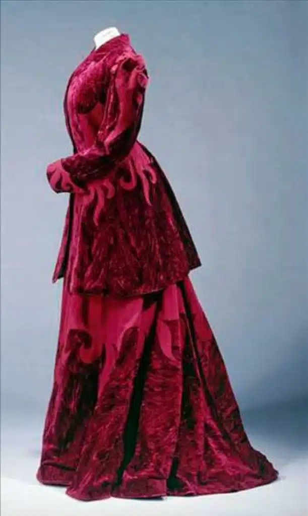 the historic allure of velvet in fashion - 1890 cherry red velvet walking suit on mannequin