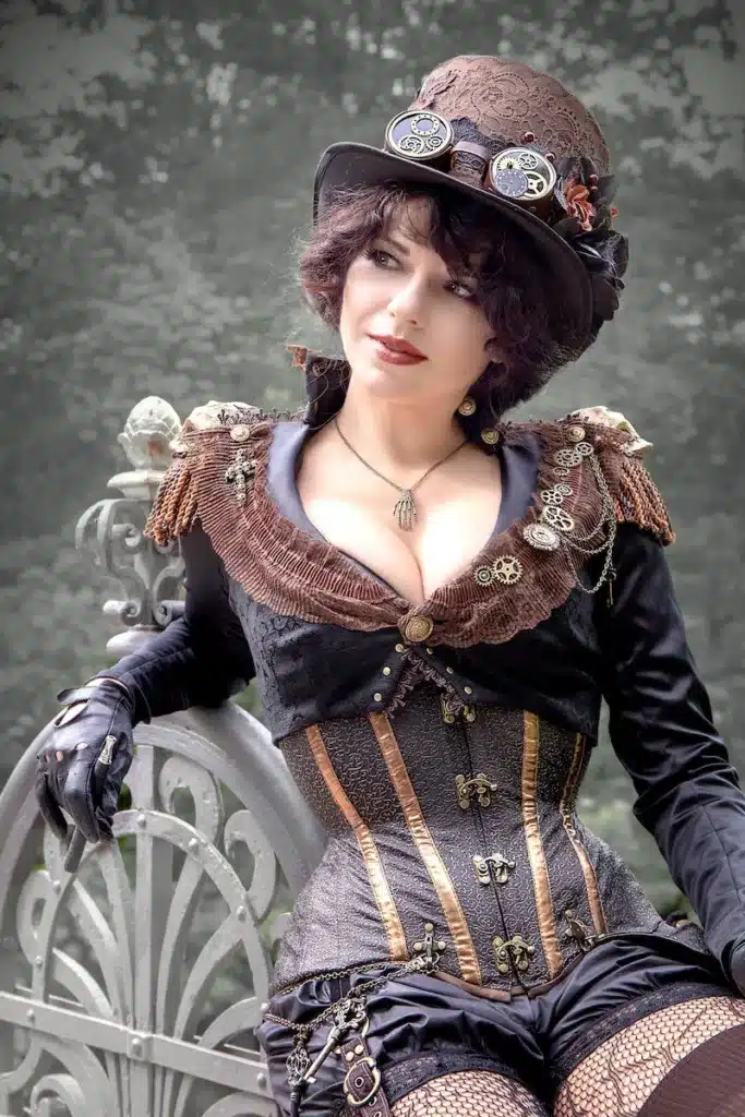 corsets make a comeback with steampunk costumery - woman dressed in steampunk costume wearing a tight corset on the outside with busk closure