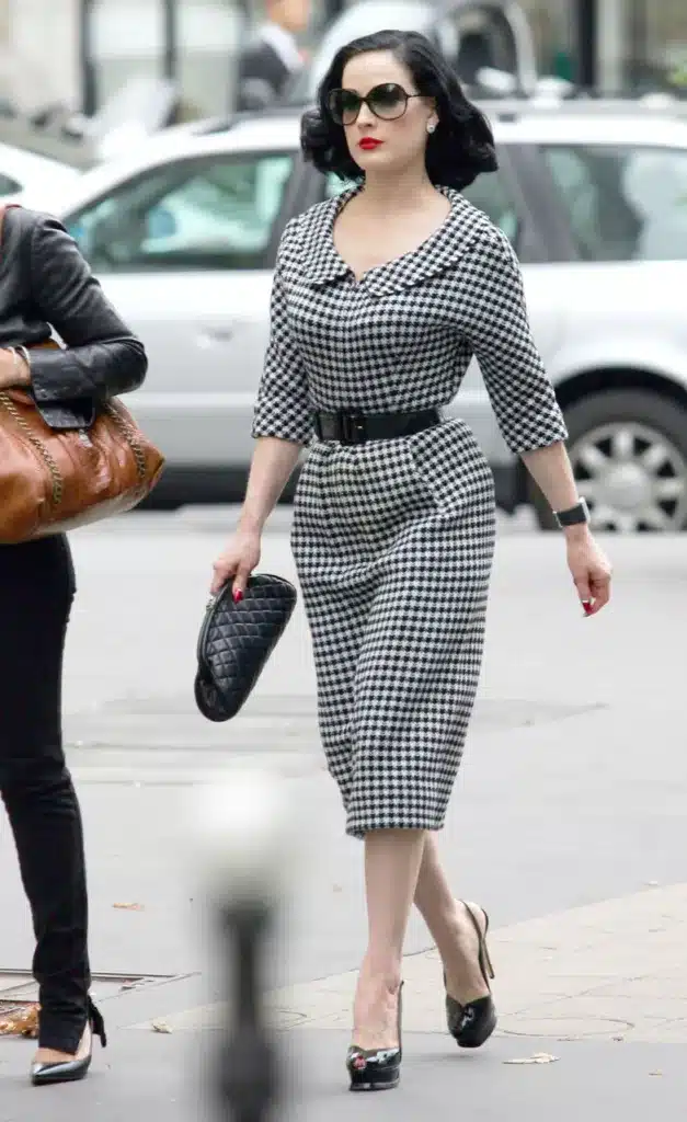 What's past is reborn in fashion styling -  Dita Von Tesse wearing a houndstooth  black and white 60's suit dress.