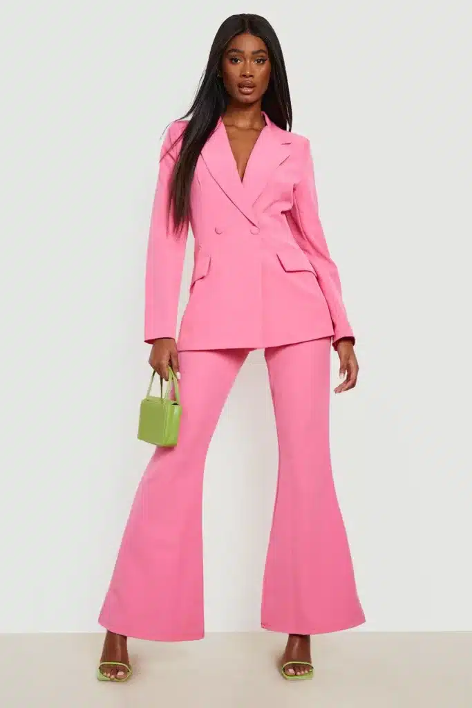 What's past is reborn again - in fashion african/american woman wearing a 70's flared suit in pink