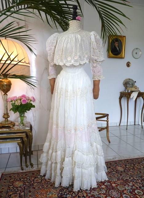White flowing Edwardian dress with high neck and long sleeves in soft fabric