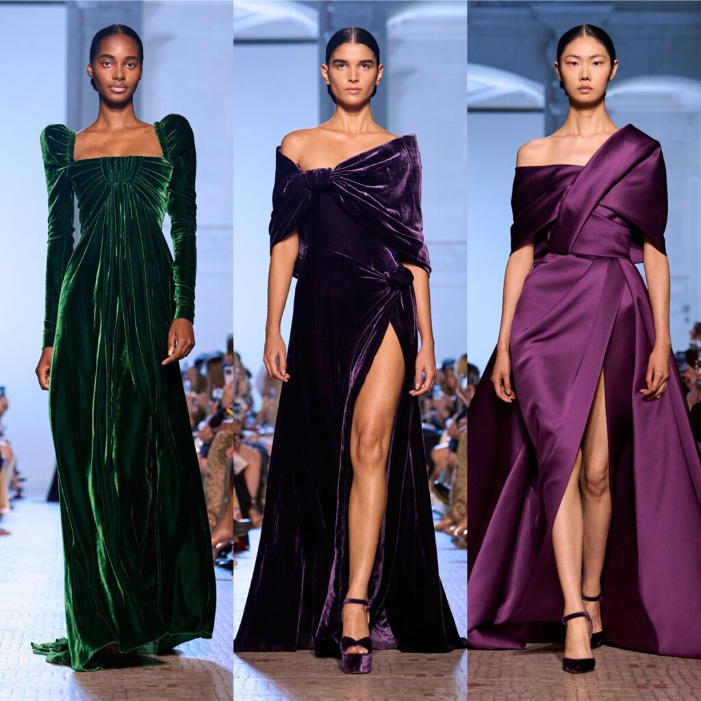 3 models on the catwalk modelling Elie Saab designed glamour style gowns