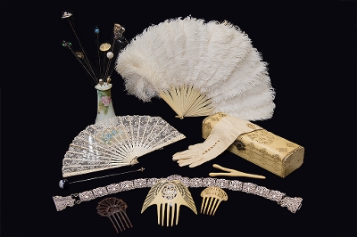 Edwardian accessories including feathered fans, diamond jewellery gloves and hair combs