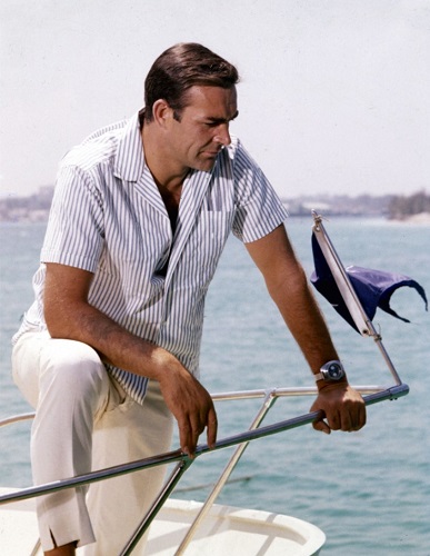 Sean Connery on a boat in striped shirt and capri pants from the movie Thunderball