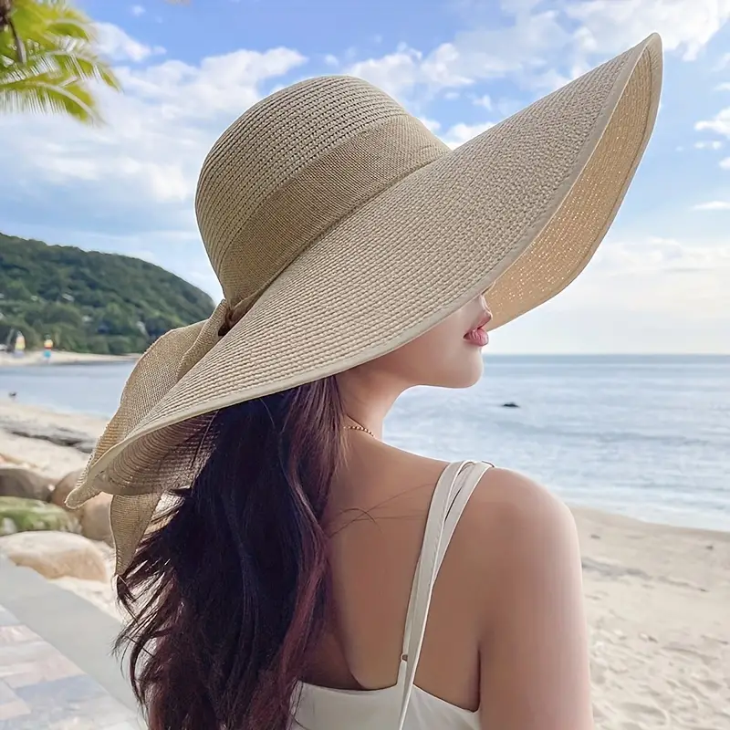 Lady wearing a beautiful full brim straw hat with hessian detail