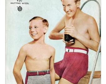 Father and son posing for 1950's wool ad wearing woolen belted bathers holding a camera 