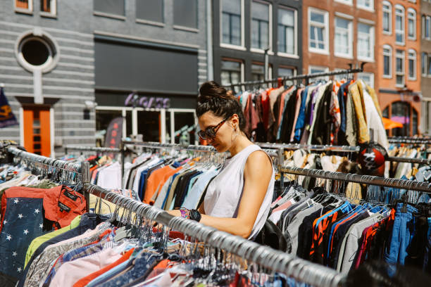 lady at outdoor thrift shopping market in summer