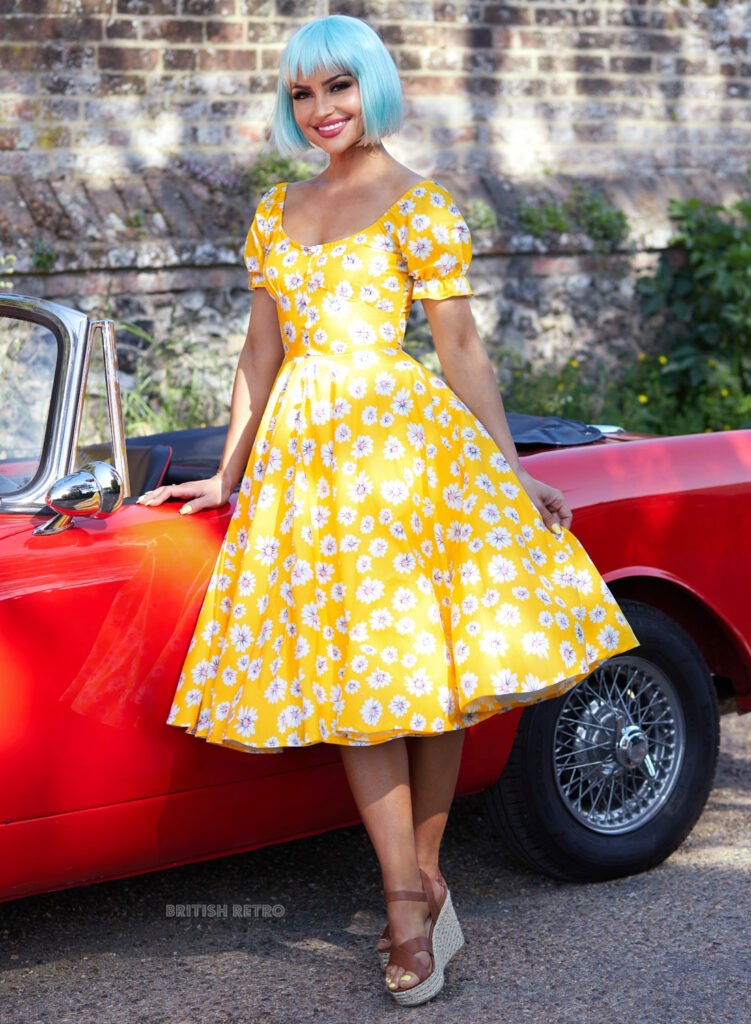 1950's cinched waist yellow dress with spot design and short sleeves with round neckline