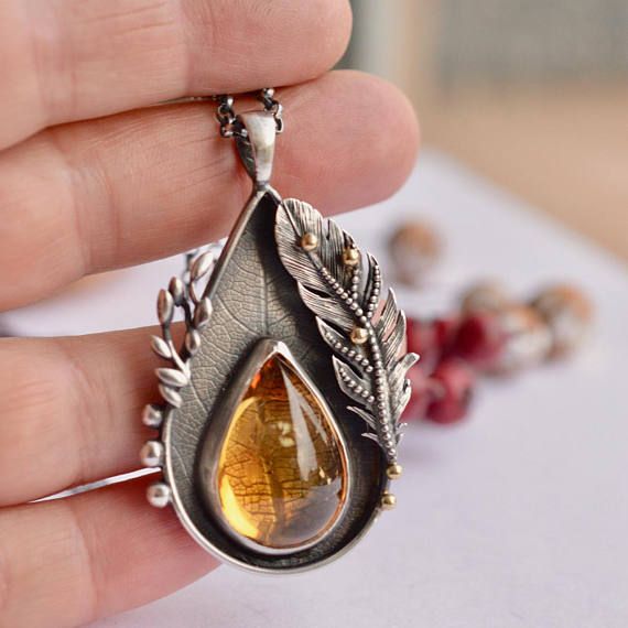 Tiger eye stone pendant on titanium metal