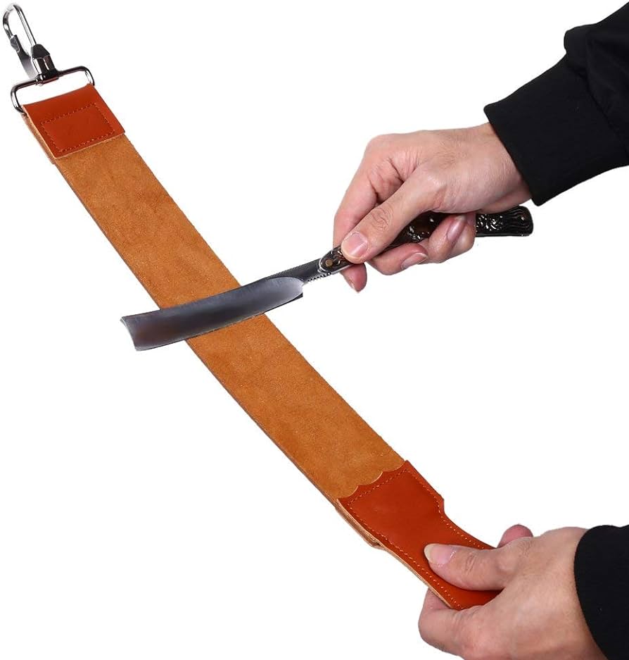 men's leather strop being sharpened