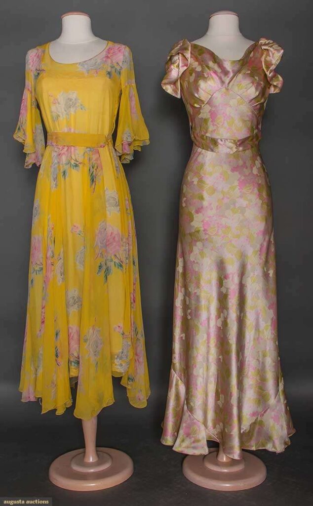 2 dresses on mannequins - one in yellow floral chiffon and the other in floral rose gold satin and asymmetrical lower hem