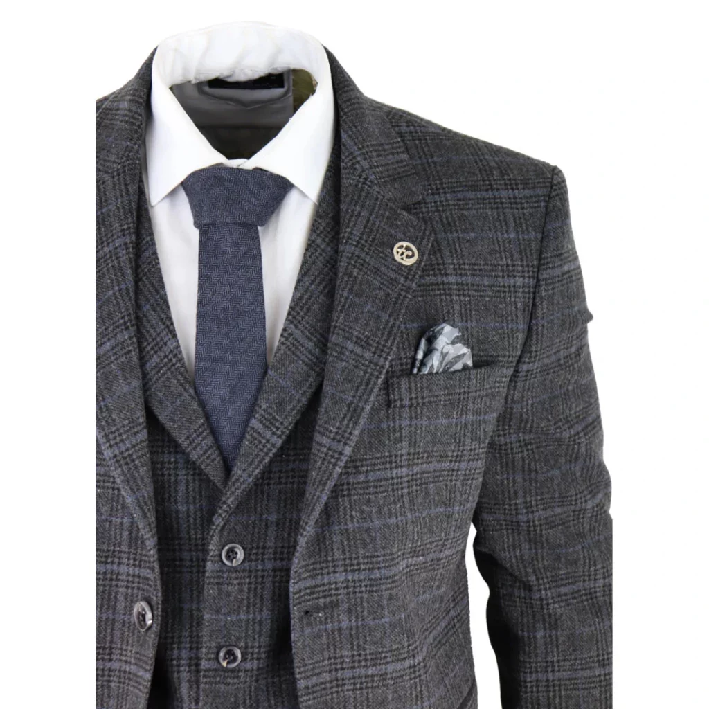 3 piece grey suit on mannequin with blue tie and white shirt