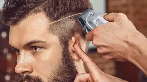 Man having razor fading cut